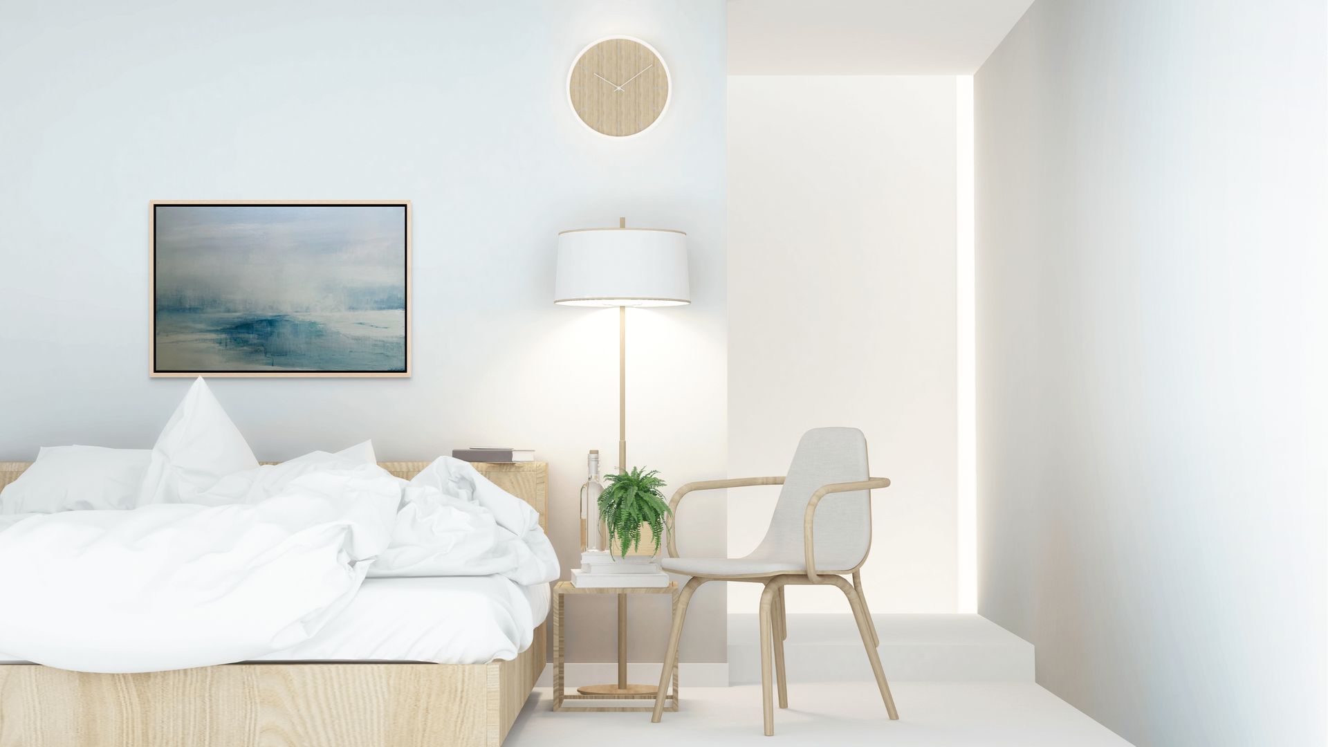 Modern bedroom with a bed, chair, lamp, and  abstract blue and grey seascape artwork on a white wall.