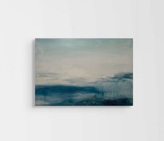 Abstract painting with blue and gray tones on a white wall